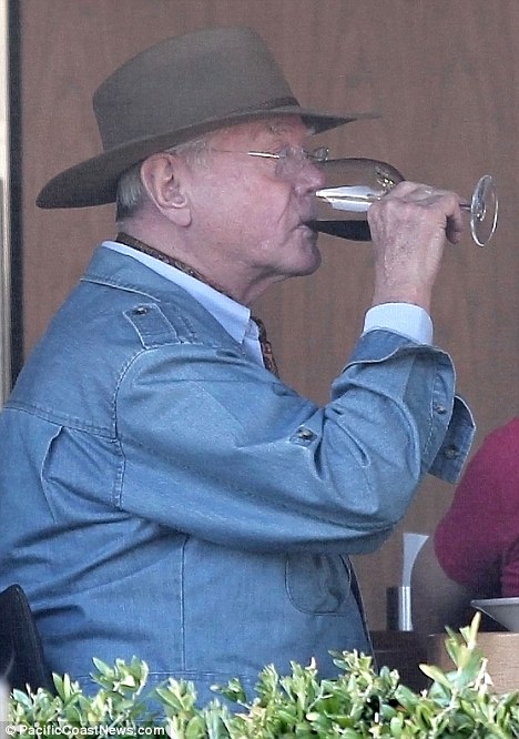 Delicious: Larry looked as though he was really enjoying his glass of wine as he dined with his friend